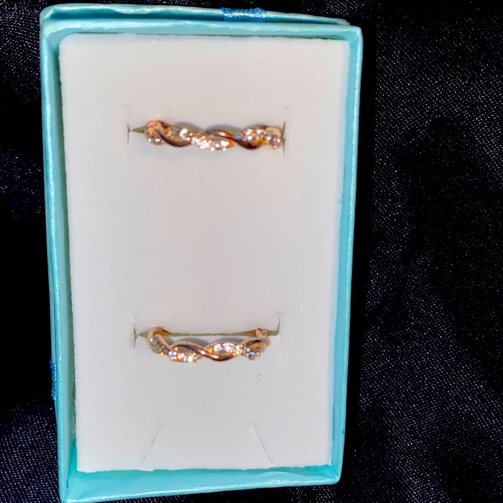 2 10K GOLD PLATED RINGS WITH DIMONIQUES AROUND THEM SIZES 6 & 7.